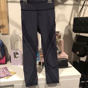 Navy cropped Lululemon leggings with mesh on the sides